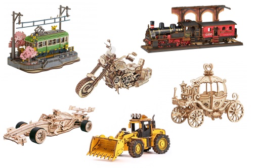 Lasercut Fahrzeuge auf der Starße und Schiene